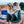 Cute girl sitting in a chair with her dog jumping up next to her